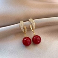 Macro detail of gold-plated earring with clear zircons and glossy dark red sphere pendant - 30# Silver Pin-Gold-Red