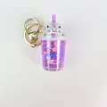 Purple milk tea cup keychain with liquid glitter sand and a cute white cat figure - Purple Flowers