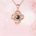 Rose gold swirling projection necklace with white zircon pavé and 100 languages stone - Double Oval Rose Gold