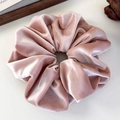 Detailed close-up of premium dusty pink velvet scrunchie showing soft fabric texture - Carmine Pink
