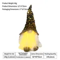 Close-up of lighted Christmas gnome with gold sequin hat and warm yellow LED glow - Black Gold Sequin Hat / Green (Black Gold Sequin)