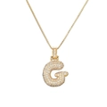 Detail of gold letter G pendant with micro-pave zircon on a polished box chain - Letter G