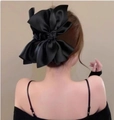 Large black satin double-layered bow hair claw clip shown on a model hair bun - Extra Large Black Bow Claw Clip