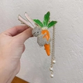 Macro shot of rabbit hair claw clip with silver rhinestones and long pearl tassel charms - Rabbit Carrot Pearl Tassel Claw