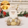 Statuetta di Babbo Natale seduto luminoso in bianco e oro con luce LED soffusa calda - Seduto Luminoso / Babbo Natale
