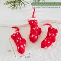 Three mini red knit Christmas socks with white dots for festive tree hanging decorations - Knitted Style (Red Sock)
