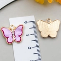 Pendentif papillon en alliage doré avec émail violet, strass et règle de mesure - Violet