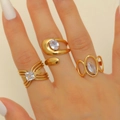 Macro shot of three gold rings with drop zircon and geometric double layer lines - Design Rings Set of 3 Combination 20