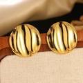 Golden round stud earrings with unique ocean wave texture in minimalist design - Gold Wavy Textured Circular Stud Earrings