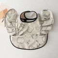 Waterproof baby bib with frilled wing sleeves and cartoon toast print in cream - Wings-shaped Finger Biscuits / One Size