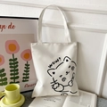 White canvas tote bag featuring a cute cat illustration and 'wow!' text in a lifestyle set - White with Wow Cat