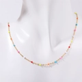 Bohemian gold chain necklace with colorful beads on mannequin, minimalist style layer - Colorful