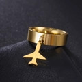 Polished gold stainless steel plane charm ring on dark textured surface - US 7 / Gold