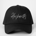 Adjustable black cotton baseball cap featuring white Husbands embroidery text on the front - One Size / Black