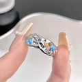 Macro detail of silver lava texture ring with blue enamel star and purple zircon - Lava Star Purple Zirconia Open Ring (JZ2979)
