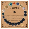 Detail of Taurus zodiac bracelet with natural stone beads and gold charms on a card - Taurus