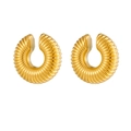 Macro view of gold chunky C-shaped hoop earrings with detailed ribbed texture details - Gold