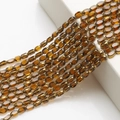 Detailed view of faceted oval gold glass beads for DIY necklaces and bracelets - 4x6mm Gold Edged Seed Beads approx. 48pcs/Strand / Amber Gold Edge