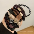 Elastic hair ties set with heart and smiley face charms in brown and black tones - Mixed Style B