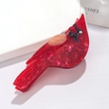 Close-up of red cardinal bird hair claw clip featuring polished marble texture finish - Cardinal