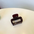 Detail of a glossy wine red square hair claw clip made of elegant resin material - Cherry Red