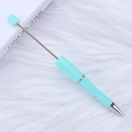 Creative macaron light blue beaded ballpoint pen with rose flower top on plush background - Candy Light Blue