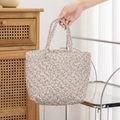 Detailed view of floral quilted cotton makeup bag with soft texture and sturdy handles - Pink Floral