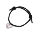 Detailed view of woven heart charm bracelet featuring inlaid pink and white zircons - Black Pink White Zircon Heart