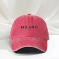 Close-up of vintage washed pink baseball cap featuring Milano Italy black printed logo - One Size / Watermelon red