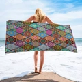 Detail view of microfiber beach towel featuring vibrant mandala patterns and geometric prints - Mandala Patchwork