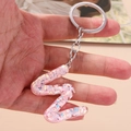 Pink sequin letter Z keychain made of transparent resin with a silver metal ring - Letter W