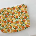Mini canvas zipper coin purse with vibrant orange citrus print and white top closure - Yellow Orange