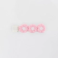 Close-up of three pink and white embroidered flowers on a sweet floral hair clip - Pink and White