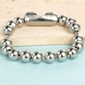 Polished 8mm stainless steel bead bracelet with a brushed metal cylindrical clasp - Steel