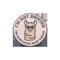 Cartoon alpaca metal badge with I'M NOT DRIVING text on a beige round brooch - Alpaca Style (XZ9975)