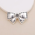 Close-up of silver metal bow with a central rhinestone and black stitching details - D251 Small Bow (Silver)