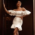 Elegant white two-piece satin set featuring ruffle off-shoulder top and ruched mini skirt - XS / White