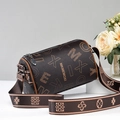 Brown cylindrical crossbody bag with floral letter patterns and wide strap in studio setting - Coffee