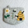 Detail view of handmade wool felt bee pouch with 12.5x15.5cm size dimensions shown - Bee Honeycomb Style