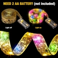 Detail of gold LED ribbon light showing battery box and color lights on black background - 3m 30LED (2AA Battery Box - Battery Not Included) / Gold - Multicolor