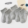 Five pairs of grey mesh cotton kids socks with non-slip silicone grippers on soles - Solid Color Mesh With Adhesive Dots [gray]