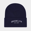 Macro detail of white Brooklyn embroidery on a dark blue knitted beanie hat - Navy Blue