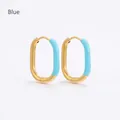 Close-up of U-shaped oval earrings with gold plating and light blue enamel inlay - Blue