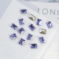 Macro view of purple K9 crystal rhinestones with pointed back and facet cuts - Rectangle Right Angle 6x8mm