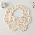 Macro shot of petal-shaped cotton gauze baby bib with delicate pink floral pattern - Gauze Flower Bandage - Crushed Flowers