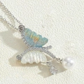 Silver butterfly pendant necklace with blue iridescent wings and dangling pearl detail - Platinum Butterfly