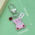 Pink cartoon bear keychain with wish tag and blue bow pendant for bags - Pink Resin Bear