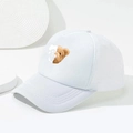Detail of white trucker hat featuring a creative teddy bear and skull print on front panel - One Size / White
