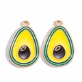 Detail shot of gold-plated avocado enamel pendants with vibrant green and yellow colors - Avocado