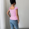 Pink striped square neck blouse with puff sleeves and pleated hem in a back view - S / Pink